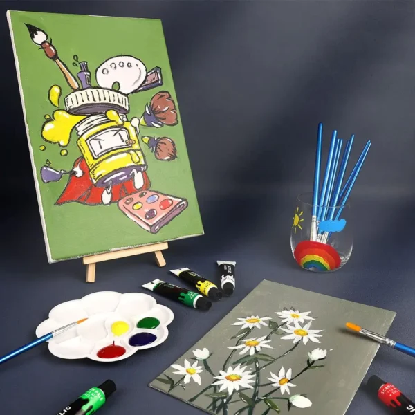 A compact paint and canvas kit is showcased against a soft, neutral background, emphasizing a collection of gouache paints neatly aligned next to a fresh, medium-sized canvas resting on a miniature tripod. Accompanying the paints are several slender brushes, their bristles still perfectly shaped, and a clear water jar that catches the light, hinting at the beginning of a creative journey. The entire set whispers the promise of artistic exploration and the allure of painted dreams yet to unfold.